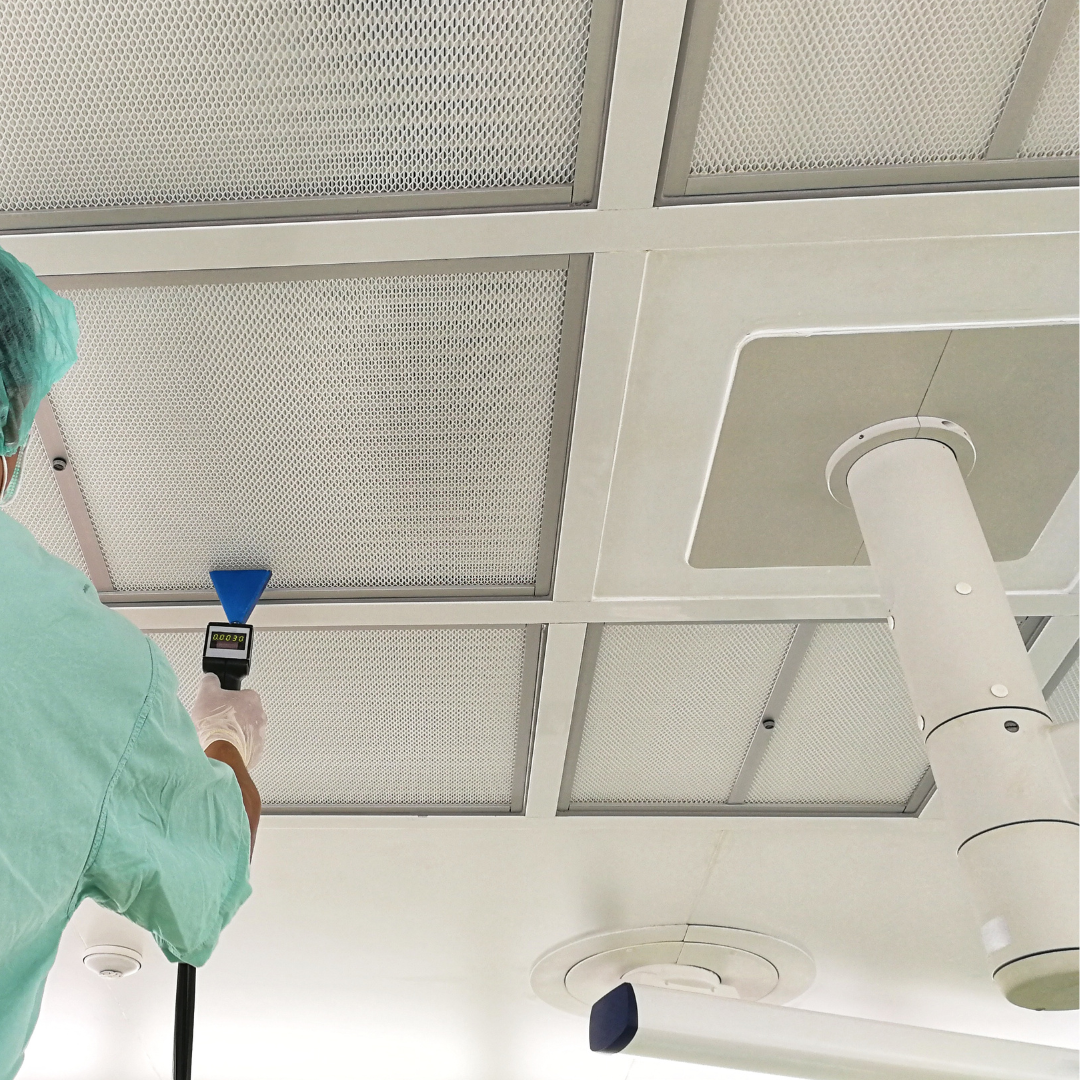 A test and balance technician checking the air flow in a critical room